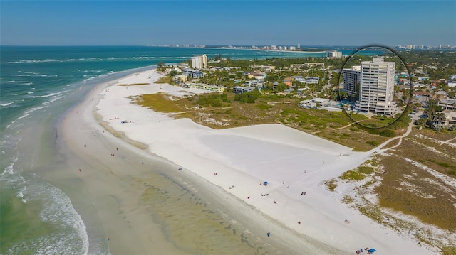 aerial view with a water view and a beach view