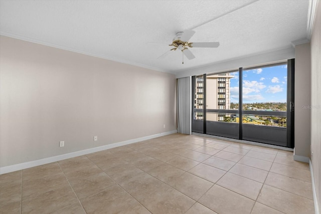 tiled spare room with crown molding, ceiling fan, and a textured ceiling