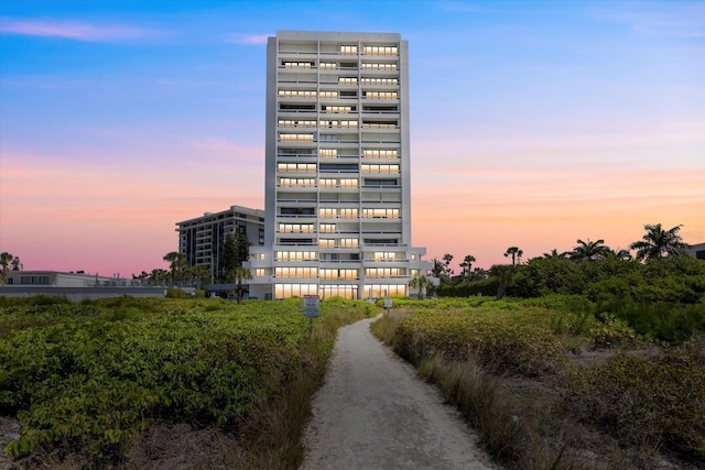 view of outdoor building at dusk