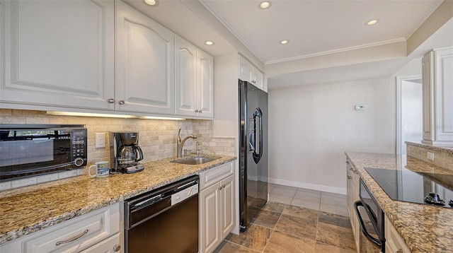 kitchen with white cabinetry, black appliances, and light stone counters