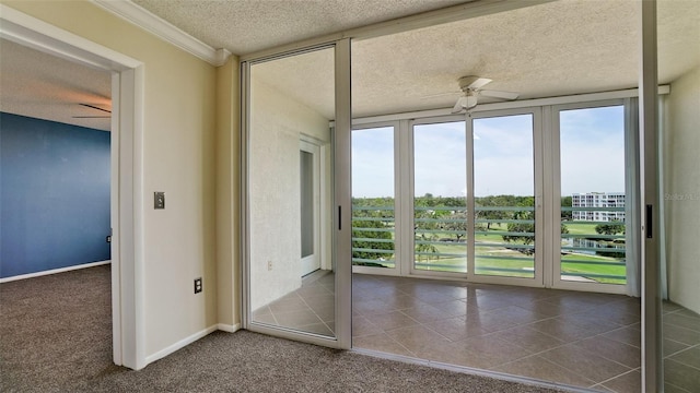 unfurnished sunroom with ceiling fan