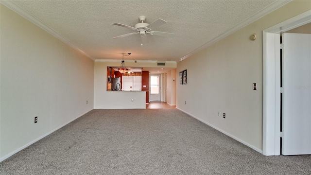 unfurnished living room with ornamental molding, carpet flooring, a textured ceiling, and ceiling fan