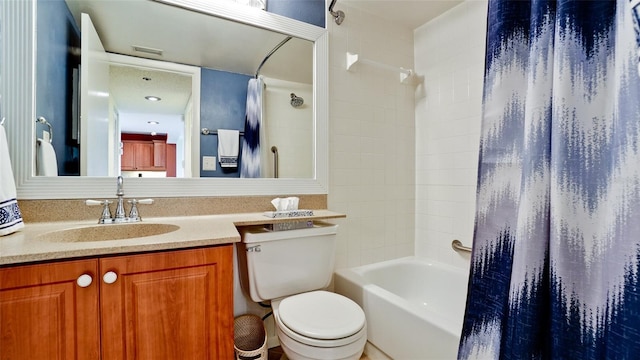 full bathroom featuring vanity, shower / bathtub combination with curtain, and toilet