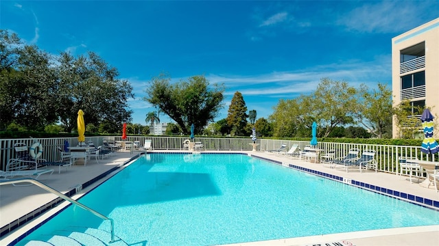 view of swimming pool with a patio area