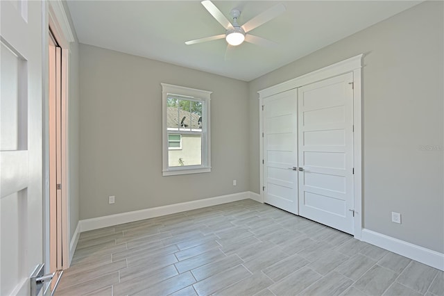 unfurnished bedroom featuring a closet and ceiling fan