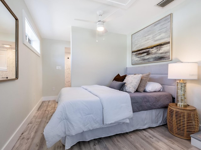 bedroom with light hardwood / wood-style floors and ceiling fan