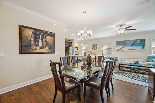 dining area with ceiling fan with notable chandelier, crown molding, and dark hardwood / wood-style floors