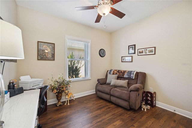 living area featuring ceiling fan and dark hardwood / wood-style flooring