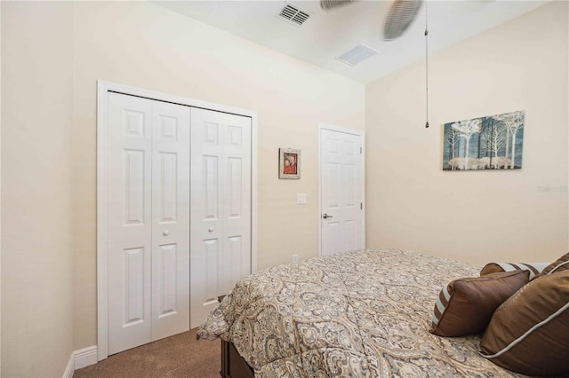 carpeted bedroom featuring a closet and ceiling fan