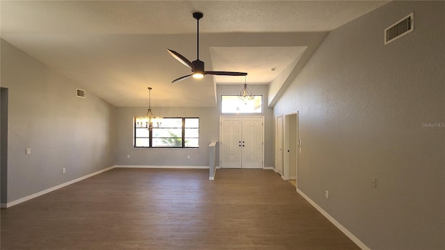 entryway featuring high vaulted ceiling, dark hardwood / wood-style flooring, and ceiling fan with notable chandelier