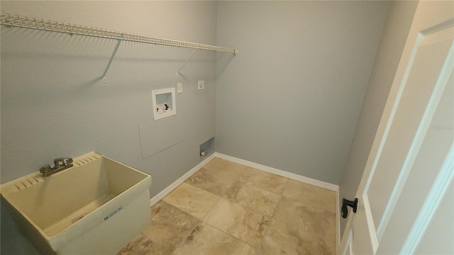 laundry area featuring hookup for an electric dryer, hookup for a washing machine, and sink