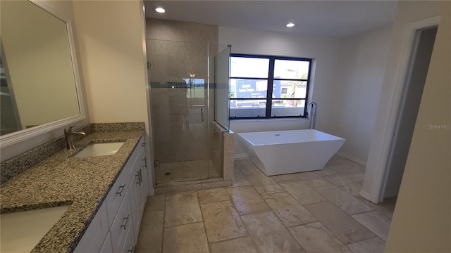 bathroom featuring plus walk in shower and vanity