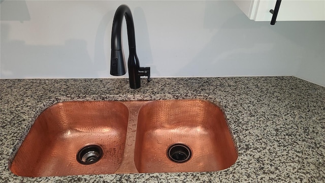 room details with sink and dark stone countertops