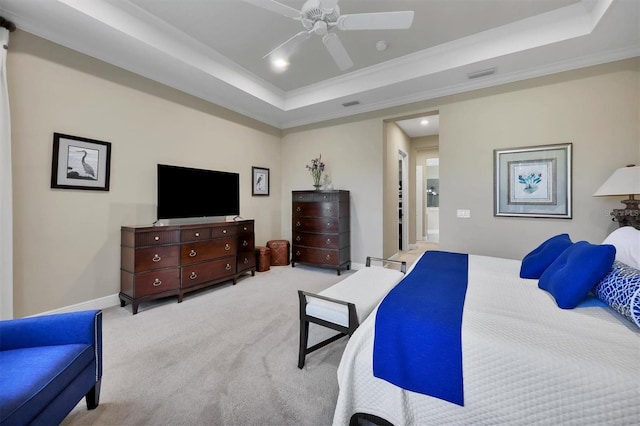 bedroom featuring ceiling fan, a raised ceiling, ornamental molding, and light carpet