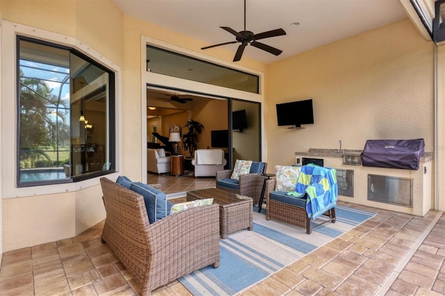 view of patio / terrace with an outdoor living space, grilling area, and ceiling fan