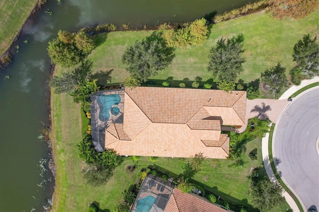 birds eye view of property with a water view