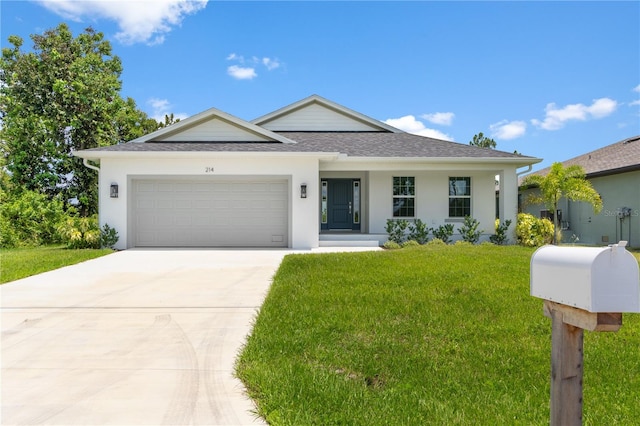 view of front facade with a garage and a front lawn