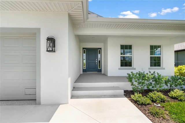 doorway to property featuring a garage