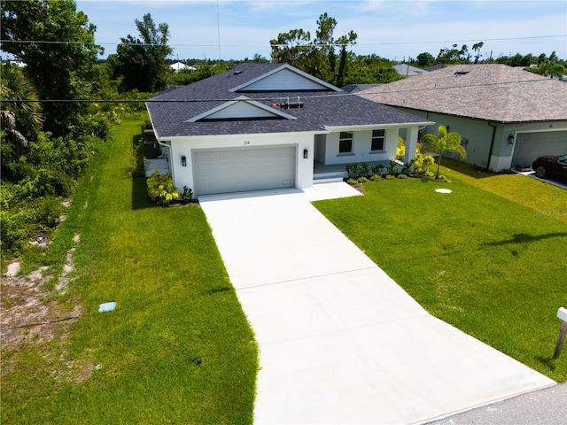 ranch-style house featuring a front yard and a garage