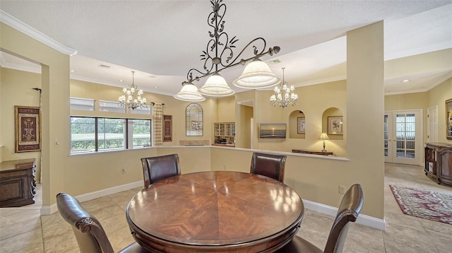 dining space featuring light tile patterned floors, a textured ceiling, and crown molding