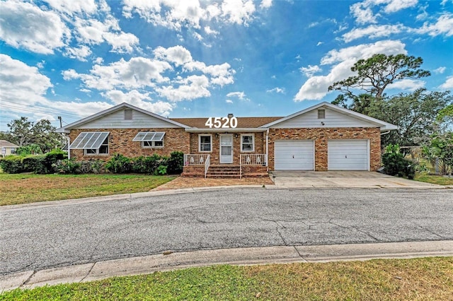 view of front of home with a front lawn and a garage