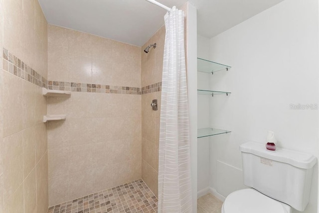 bathroom with toilet and curtained shower