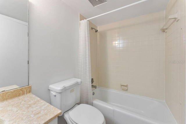 full bathroom featuring vanity, shower / bath combination with curtain, and toilet