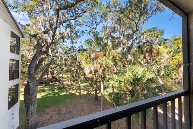 view of yard with a balcony