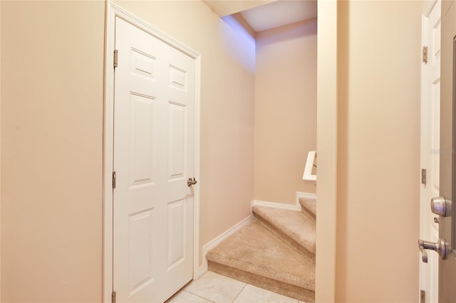 staircase with tile patterned floors