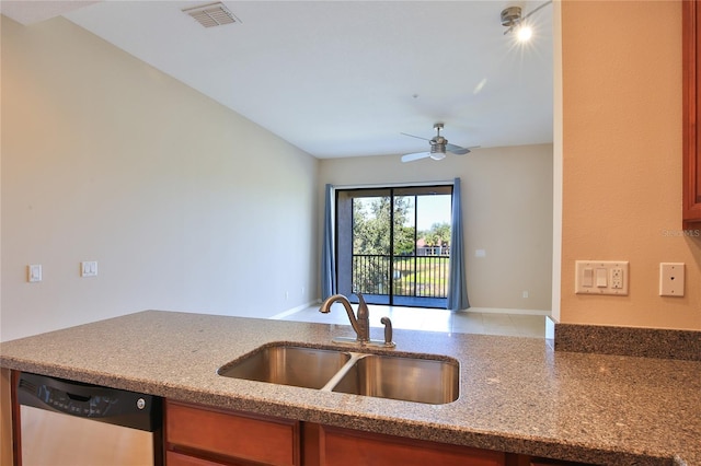 kitchen with stainless steel dishwasher, stone counters, sink, and ceiling fan