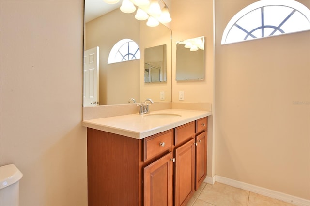 bathroom with tile patterned floors, vanity, and toilet