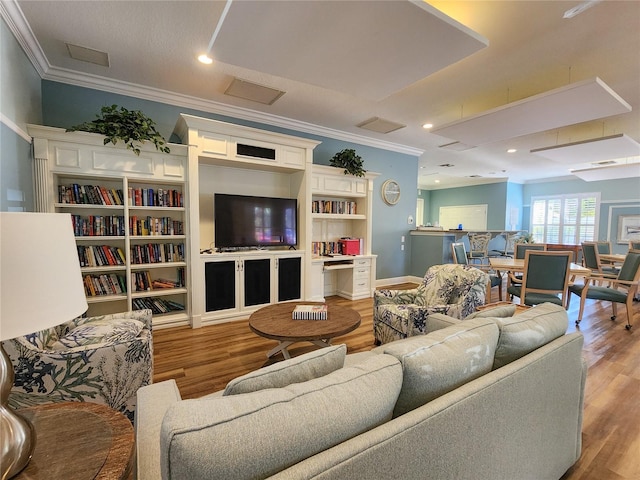 living room with crown molding and light hardwood / wood-style floors