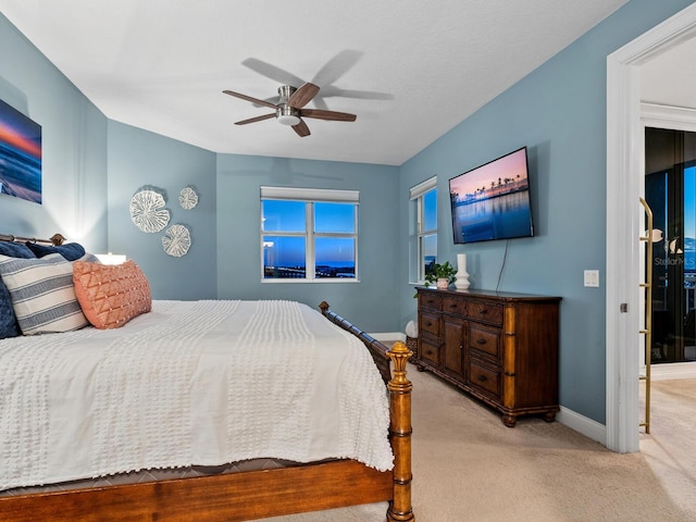 carpeted bedroom featuring ceiling fan