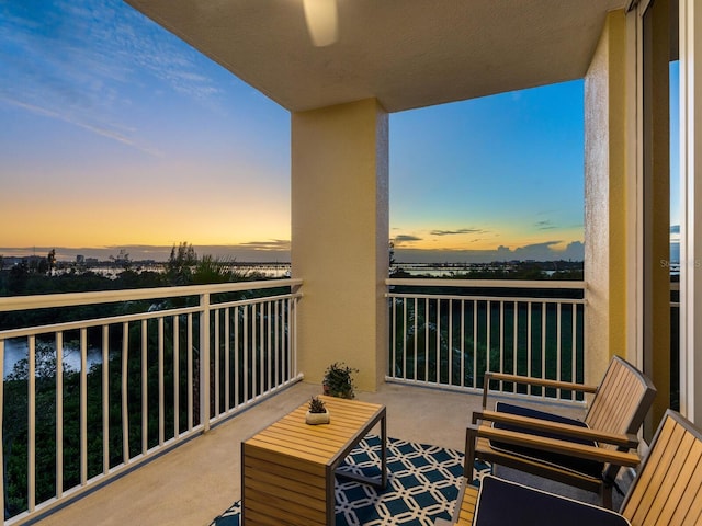 view of balcony at dusk