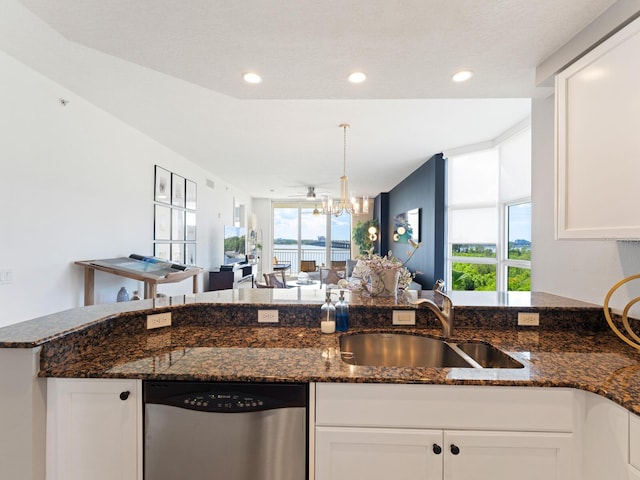 kitchen featuring white cabinetry, dishwasher, sink, and dark stone counters