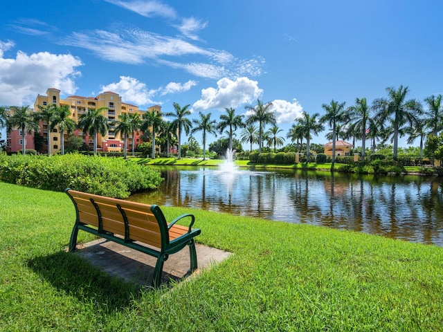 view of community featuring a yard and a water view