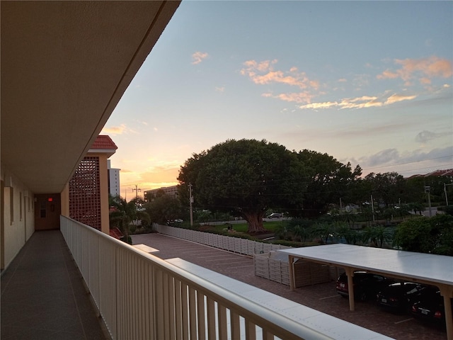 view of balcony at dusk