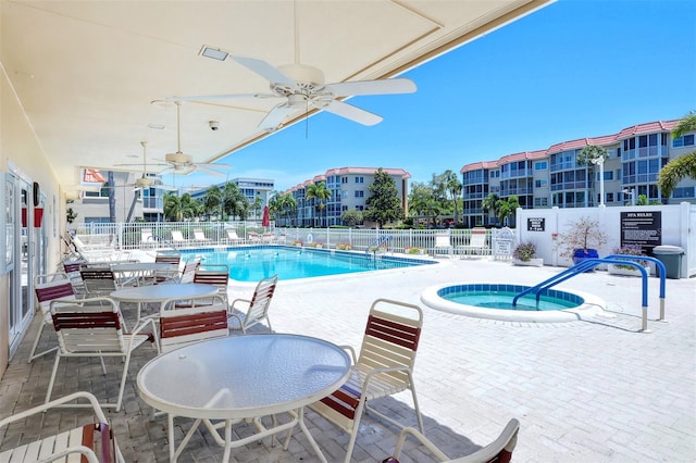 view of pool with ceiling fan and a patio area