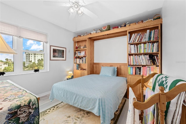 bedroom featuring ceiling fan and hardwood / wood-style flooring