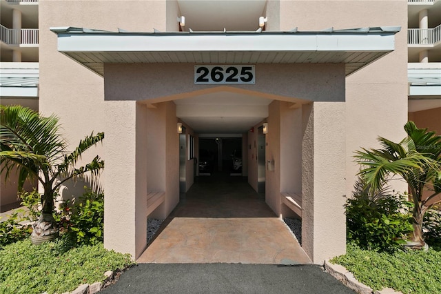 entrance to property with a balcony