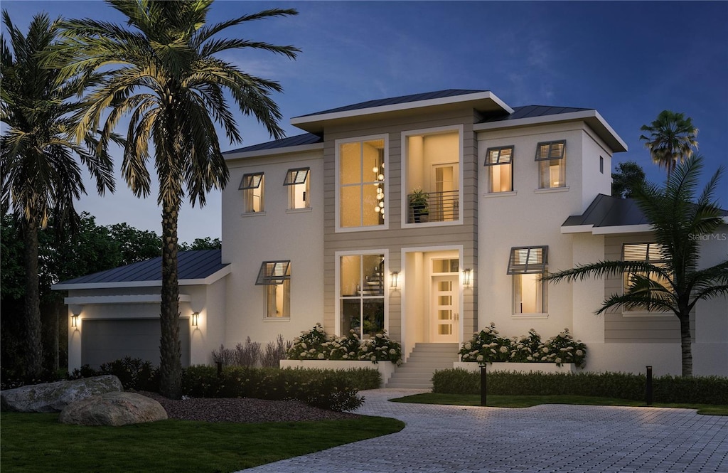 view of front of house with a garage and a front yard