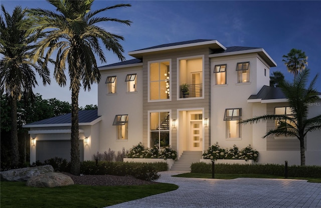 view of front of house with a garage and a front yard