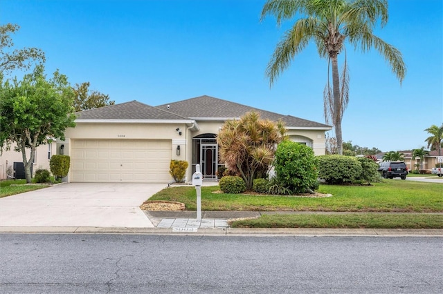 single story home featuring central AC, a front lawn, and a garage