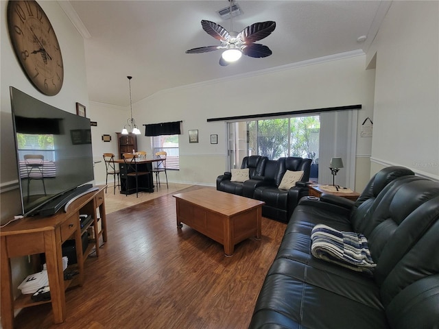 living room featuring lofted ceiling, crown molding, dark hardwood / wood-style floors, and ceiling fan with notable chandelier