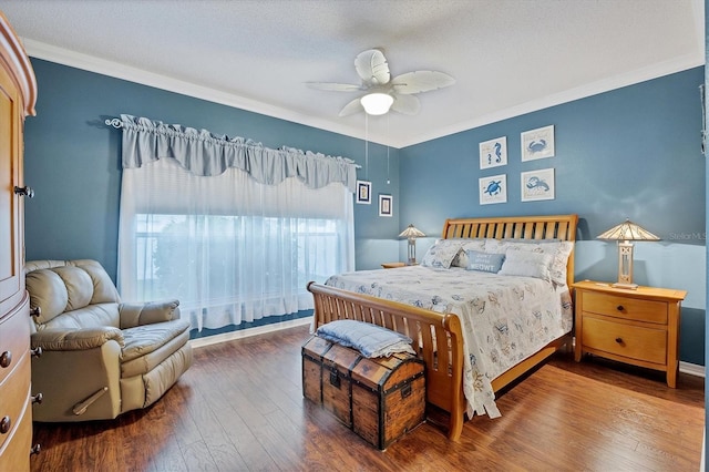 bedroom with a textured ceiling, ceiling fan, wood-type flooring, and crown molding