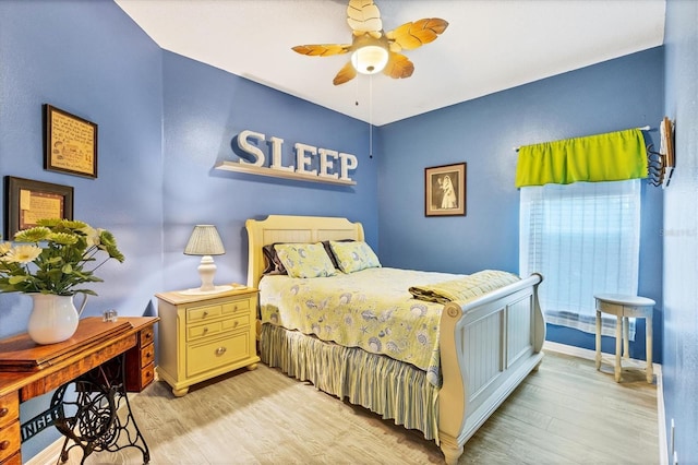 bedroom featuring ceiling fan and light hardwood / wood-style floors