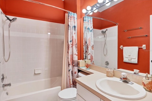 full bathroom with vanity, shower / bath combination with curtain, and toilet