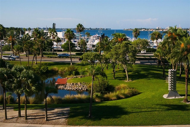 view of nearby features with a lawn and a water view