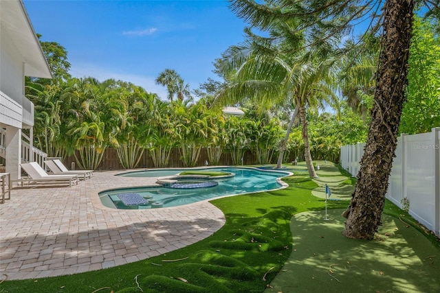 view of pool featuring an in ground hot tub and a patio area