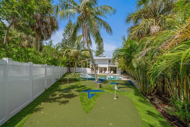 view of yard featuring a fenced in pool